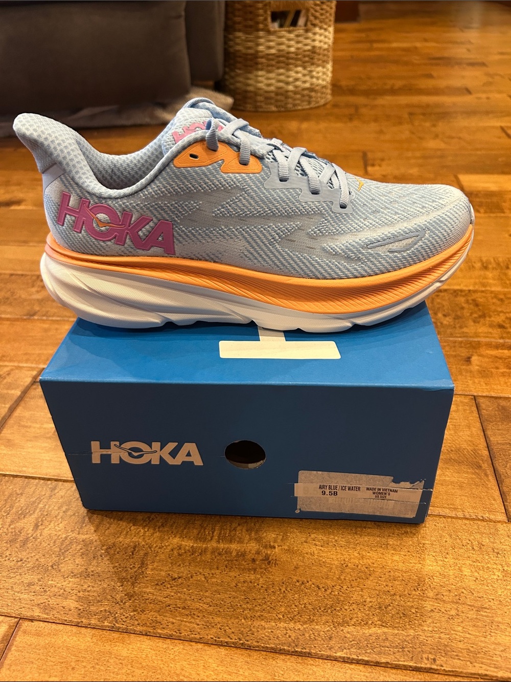 Hoka Women's Light Blue Sneakers with Orange and Pink Accents